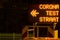 Dutch corona test street information sign ito indicate a test center at night in Arnhem, Netherlands. Translation: teststraat