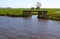 Dutch countryside with waterway and gateway