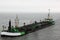 Dutch dredger in in Wadden Sea near Ameland island