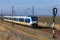 Dutch electric train traveling through the countryside