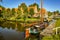 Dutch fishing boat with picturesque fishermen`s cottages in the background