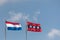 Dutch flag and the Amsterdam city flag in a row