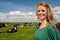 Dutch girl in field with cows