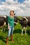 Dutch girl in field with cows