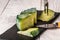 Dutch green cheese on a white background. Pesto Rosso craft cheese