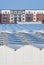 Dutch greenhouses in front of modern new built houses and apartment buildings in South Holland