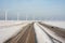 Dutch highway in wintertime with wind turbines