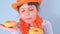 Dutch holiday King Day. Traditional festival on April 27 in the Netherlands. A little girl in a festive orange hat on a