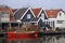 Dutch houses and boat on river Vecht in Holland