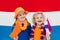 Dutch kids. Children with flag of Netherlands. Holland fans