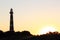 Dutch lighthouse Bornrif in Ameland dunes at sunset