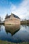 Dutch medieval castle reflected in the moat