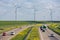 Dutch motorway near Lelystad with wind turbines and blooming rapeseed