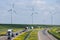 Dutch motorway near Lelystad with wind turbines and blooming rapeseed