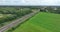 Dutch moving commercial train in nature forrest landscape. Modern sustainable commuting method. Travel transportation