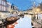 The Dutch Oude Rijn canal with bridge, historic buildings and christmas lights in the city center of Leiden