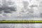 Dutch polder canal and dramatic clouds