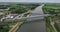 Dutch railroad metal and concrete suspension bridge infrastructure. Train track overpass aerial overhead drone view