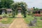 Dutch rose garden with footpath, wooden bench and pergola