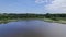 Dutch rural landscape smal lake with farmland and woodland