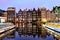 Dutch scenery with its canal side houses and tour boats