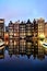 Dutch scenery with its canal side houses and tour boats