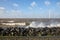 Dutch sea with off shore wind turbines and breaking waves