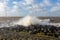 Dutch sea with off shore wind turbines and breaking waves