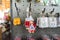 Dutch souvenirs from Holland being sold in a gift shop, with wooden clog keychains, a Dutch milkmaid keychain and flower keychains