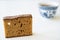 Dutch spiced bread called Ontbijtkoek or Peperkoek. And mug of coffee