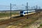 Dutch sprinter train traveling through countryside