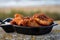 Dutch street seafood, deep fried cod fish fillet with garlic sauce called in Netherlands kibbeling and North sea beach on