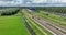Dutch train in green open grassland landscape. Green alternative sustainable transportation method. Commute traffic