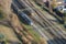 Dutch trains travelling on rail tracks shot from high angle drone style shot