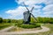 The Dutch village of Bourtange. Wooden Dutch mill and flag of Bourtange fortress