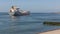 Dutch waterside Vlissingen with cargo ship sailing close to coast