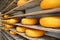 Dutch whole cheeses on a wooden shelves