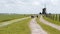 Dutch wind mill and sheep in distance