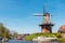 Dutch windmill against a clear blue sky