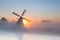 Dutch windmill in dense fog