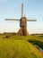 Dutch windmill in golden morning light
