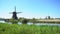 Dutch windmill over river waters