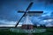 Dutch windmill over storm sky