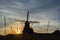 Dutch windmill, small village in North Brabant, mill and corn fields on sunset