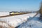 Dutch winter landscape in national park with slow train passing