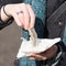 Dutch woman is eating typical raw herring