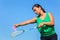 Dutch woman serve with badminton racket and shuttle