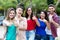 Dutch young adult woman with group of friends in line