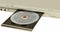 DVD player with open disk tray taken closeup on white,