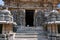 Dwarapala on the right, Ganesha and other sulptures, South entrance of Shantaleswara shrine, Hoysaleshvara Temple, Halebid, Karnat